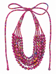 A multi-strand beaded necklace with a halter-style tie, featuring a multicolor pattern of purple, pink, green, and orange beads on a white background.