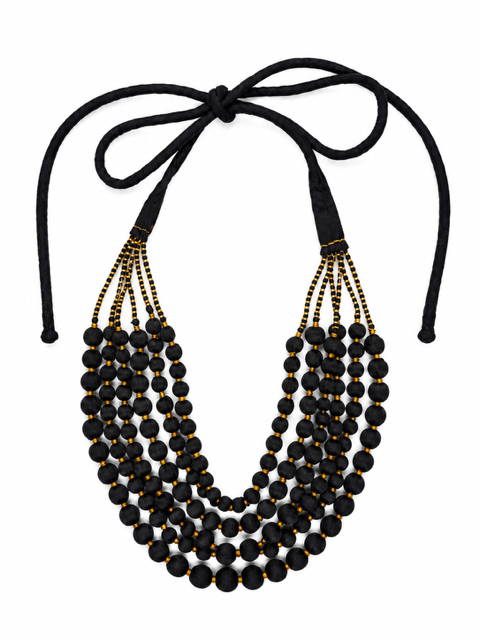 A 5 or 6 multi-strand statement necklace featuring round beads wrapped in black sari fabric with gold stitching in between and black cords tied at the top,  allowing  for various lengths of wear.